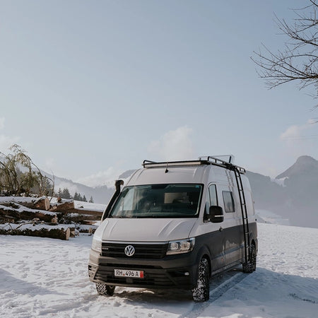 Roamer's Chewie campervan parked up in the snow.