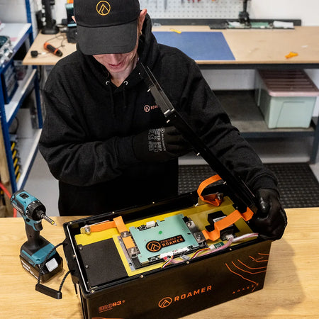 Simon from Roamer batteries opening up a SMART3 320 lithium battery in the Roamer warehouse.