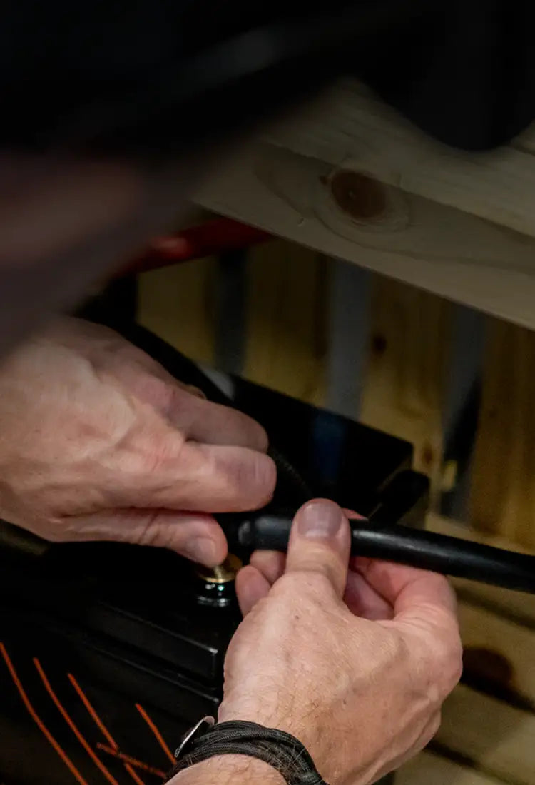 A roamer team member connecting a Roamer battery.