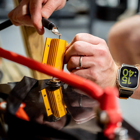 A member of the Roamer team connecting Roamer battery cables