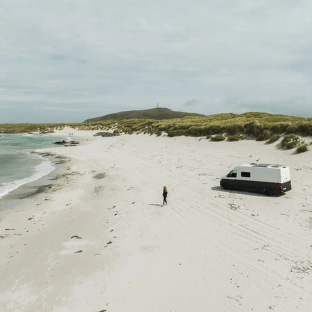Hannah Whiteley kitesurfing in Scotland with a Roamer van.